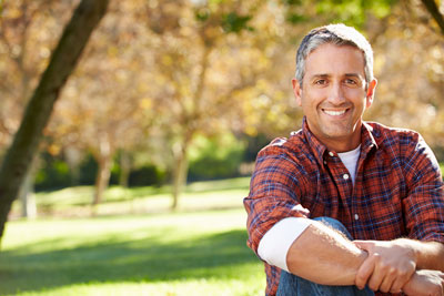 man smiling after getting a new dental crown at Chatsworth Dental Group